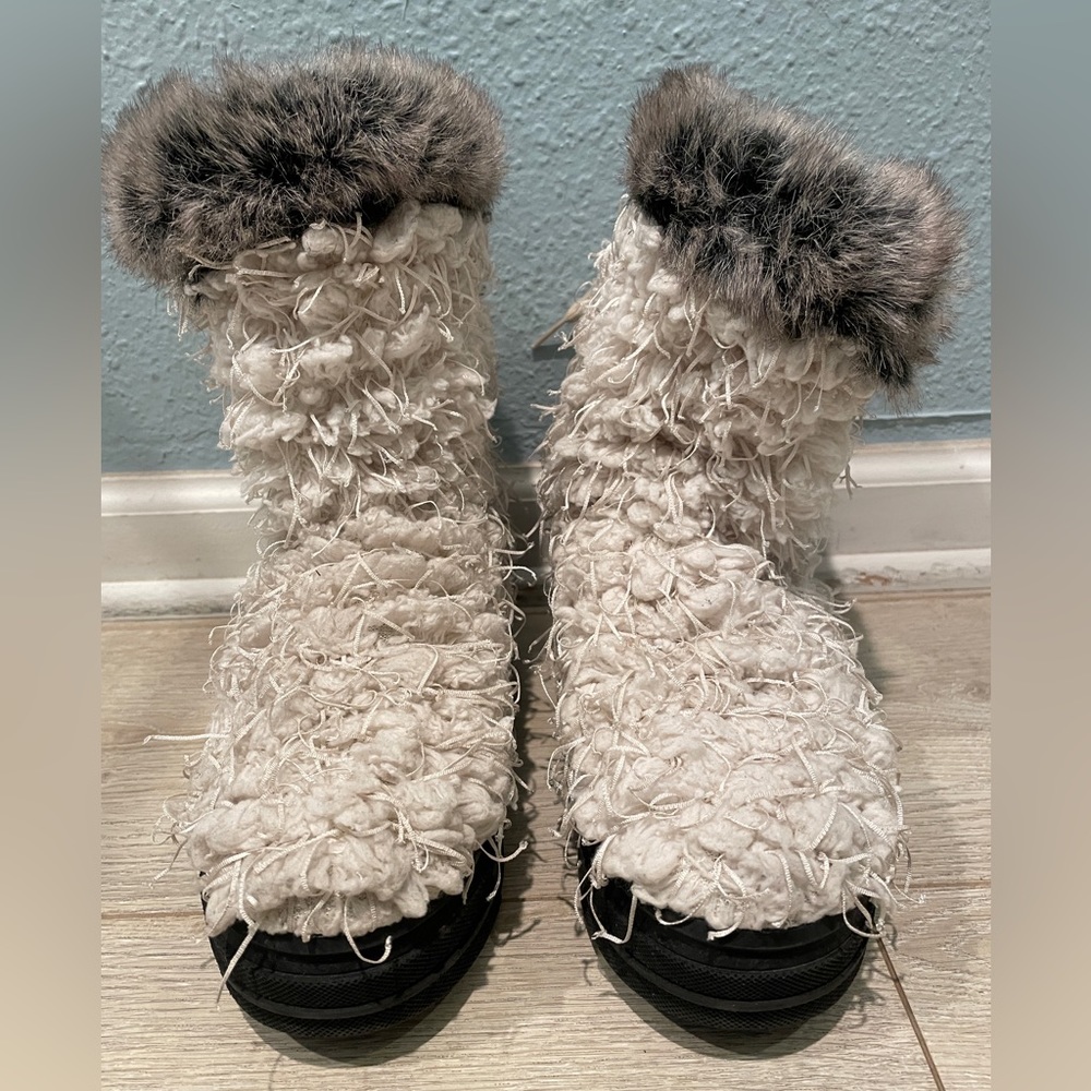 Free People Ugg style with yarn fringe.